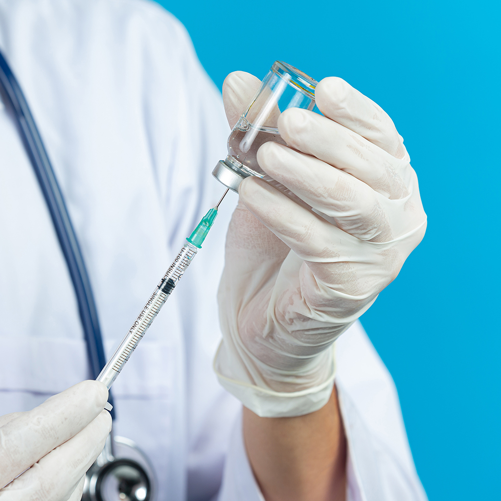 close-up-picture-docter-s-hands-holding-hypodermic-syringe.jpg